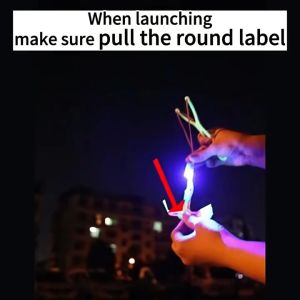 50Pcs Outdoor Shining Rocket Flash LED Light Night Kids Luminous Slingshot Toys Elastic Helicopter Rotating Toy