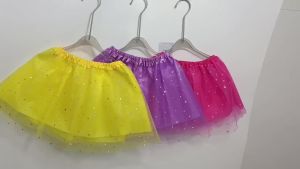 Adorned with Sparkling Star and Moon Patches This Sweet Short Tutu Skirt Features Dreamy Candy-Hued Mesh.