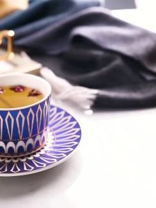 Gold Rimmed Ceramic Coffee Cup with Saucer and Spoon