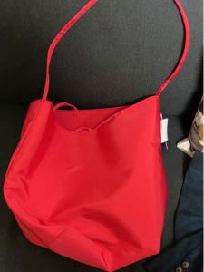 Mens and Womens Neutral Bag Womens 2024 New Arrival Nylon Cloth Shoulder Underarm Bucket Bag Red Niche Style Fashion Tote Bag