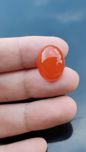 พลอยคาร์เนเลี่ยน(Carnelian)น้ำหนัก 17.86 กะรัต ขนาด 15.25 x 20.05 x 7.45 มิล พลอยสีแดงอมส้มเนื้อใส พลอยแท้จากประเทศบราซิล