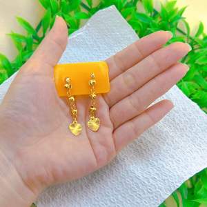 Sleek & modern: single small ball Drop earring with metallic sheen