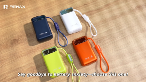 Original Remax powerbank Fast charging 65W orange portable power bank with Type-C and USB ports for charging three devices simultaneously without queuing.