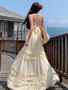 Thái Lan Phong Cách Nghỉ Dưỡng Gợi Cảm Áo Hai Dây Dây Đeo Vai Đầm Nữ Gored Váy Ảnh Bãi Biển Cà Vạt Hở Lưng Dài Đầm Phong Cách Bohemian Dễ Thương