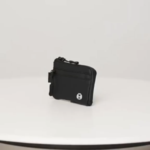 SERENITY Black RFID blocking wallet with zipper and strap. Fits on desk near laptop and payment terminal.