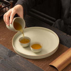 High-End Ceramic Tea Tray Ru Kiln Yellow Brown Dry Pounding Tea Table Cup Storage Tray Handmade round Plate Tea Brewing Tray