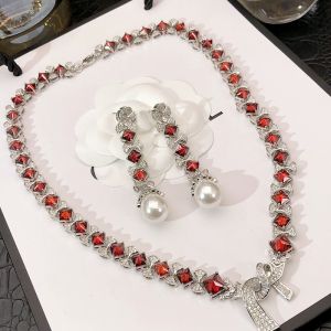 MESU.ACC | Luxurious Rhinestone Ruby Fringe Pearl Bow Necklace and Earrings Set