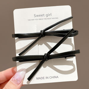 NING ZHOU | Black Leather Bow Hair Clip for Fringe and Side