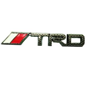 Emblem TRD Mobil Toyota Logo Lambang Motif Tulisan TRD Carbon\\n\\n Apa Itu Emblem TRD?\\n\\nEmblem TRD adalah logo lambang motif tulisan TRD yang menjadi aksesoris mobil Toyota populer. TRD sendiri merupakan singkatan dari Toyota Racing Development, sebuah divisi khusus Toyota yang berfokus pada pengembangan teknologi dan komponen performa untuk mobil balap dan kendaraan sport.\\n\\n Sejarah dan Desain Emblem TRD\\n\\nSejak didirikan pada tahun 1972, TRD telah berkembang menjadi salah satu pemimpin dalam industri otomotif, memproduksi berbagai komponen performa dan aksesoris kendaraan. Emblem TRD adalah salah satu ikon yang menggambarkan identitas TRD dan menjadi simbol prestasi serta inovasi mereka.\\n\\nDesain emblem TRD biasanya terdiri dari logo Toyota yang dikelilingi oleh tulisan \"TRD\" di bagian bawah. Logo ini sering digunakan pada mobil-mobil balap dan kendaraan sport yang diproduksi oleh TRD, serta menjadi aksesoris populer bagi penggemar mobil Toyota yang ingin menambahkan sentuhan sporty pada kendaraan mereka.\\n\\n Peran Emblem TRD dalam Desain Mobil Sporty\\n\\nEmblem TRD memiliki peran penting dalam desain mobil sporty, karena logo ini mampu memberikan kesan eksklusif dan performa tinggi pada kendaraan. Penggunaan emblem TRD pada mobil Toyota dapat meningkatkan daya tarik estetika dan nilai jual kendaraan tersebut.\\n\\n Cara Menggunakan Emblem TRD\\n\\nMenggunakan emblem TRD pada mobil Toyota adalah cara mudah untuk menambahkan sentuhan sporty dan eksklusif pada kendaraan Anda. Berikut ini adalah langkah-langkah pemasangan emblem TRD:\\n\\n1. Pilih lokasi yang tepat untuk menempatkan emblem TRD pada mobil Anda. Biasanya, emblem TRD ditempatkan pada bagian depan atau belakang mobil, atau pada pintu samping.\\n2. Bersihkan permukaan mobil di mana emblem akan dipasang. Pastikan permukaan tersebut bebas dari kotoran, minyak, atau residu lainnya.\\n3. Tempelkan emblem TRD pada permukaan yang telah dibersihkan. Pastikan emblem ditempatkan dengan rapi dan tidak ada gelembung udara di bawahnya.\\n4. Biarkan emblem TRD menempel selama beberapa jam sebelum digunakan untuk memastikan pengikatan yang kuat.\\n\\n Tips untuk Memilih Emblem TRD yang Tepat\\n\\nBerikut ini adalah beberapa tips untuk memilih emblem TRD yang tepat untuk mobil Toyota Anda:\\n\\n- Pertimbangkan desain emblem TRD yang sesuai dengan model dan warna mobil Anda.\\n- Pilih material emblem TRD yang tahan lama dan mudah dibersihkan.\\n- Jika Anda ingin menambahkan sentuhan sporty pada mobil Anda, pertimbangkan untuk menggunakan emblem TRD Carbon yang lebih ringan dan kuat.\\n\\n Keunggulan Emblem TRD Carbon\\n\\nEmblem TRD Carbon adalah salah satu jenis emblem TRD yang populer karena kelebihan dan keunggulannya. Berikut ini adalah beberapa kelebihan dan keunggulan emblem TRD Carbon:\\n\\n- Lebih ringan dibandingkan dengan emblem TRD biasa, sehingga dapat meningkatkan performa mobil.\\n- Lebih kuat dan tahan lama, sehingga cocok untuk penggunaan jangka panjang.\\n- Lebih mudah dibersihkan dan tidak mudah berkarat.\\n\\n Perbandingan dengan Emblem TRD Lainnya\\n\\nBerikut ini adalah perbandingan antara emblem TRD Carbon dengan emblem TRD lainnya:\\n\\n| Ciri-ciri | Emblem TRD Carbon | Emblem TRD Biasa |\\n| --- | --- | --- |\\n| Berat | Lebih ringan | Lebih berat |\\n| Keawetan | Lebih kuat dan tahan lama | Tahan lama, namun lebih mudah berkarat |\\n| Mudah dibersihkan | Lebih mudah dibersihkan | Kurang mudah dibersihkan |\\n\\nDengan mempertimbangkan kelebihan dan keunggulan emblem TRD Carbon, Anda dapat memilih aksesoris yang tepat untuk menambahkan sentuhan sporty pada mobil Toyota Anda.\"\n}