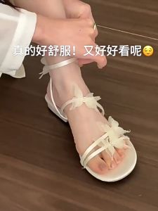 dép xăng đan Nhẹ nhàng buổi tối làn gió đế bằng cho phụ nữ mặc ngoài mùa hè 2024 Mới thắt nơ nhẹ và dép quai hậu thời trang đa năng