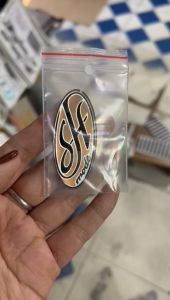 Logo SH Mode dán ở mặt nạ trước xe.(giá 1 cái)
