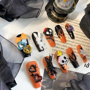 เล็บรูปโลงศพทําด้วยมือ 10 ชิ้น เล็บปลอมที่สวยงาม หัวกะโหลกตลก เล็บฟักทองสีส้ม เหมาะสําหรับผู้หญิงในการใช้งาน