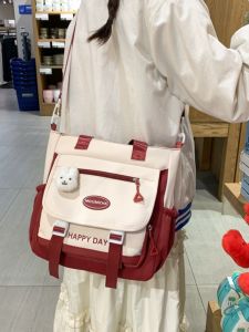 กระเป๋าสะพายข้างผ้าใบสไตล์ญี่ปุ่นสำหรับนักเรียน มีซิปปิด พื้นที่เก็บของขนาดใหญ่ กระเป๋าสะพายข้างผู้หญิง ทรงกระเป๋าถือแบบกลม