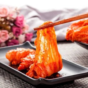 Authentic KOREA KIMCHI - Fermented Cabbage - Spicy Red Paste - Traditional Korean Side Dish - Served on Black Plate with Chopsticks - Fresh and Crunchy - Perfect for Meals and Snacks