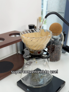 VOLKAFE V60 set glass coffee dripper with measurement markings and black handle.