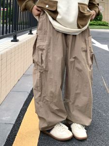 กางเกงทำงานทรงหลวมสไตล์ญี่ปุ่นย้อนยุคหลายกระเป๋าสำหรับผู้ชายและผู้หญิง กางเกงขายาวทรงหลวมสำหรับคู่รัก กางเกงขายาวลำลอง