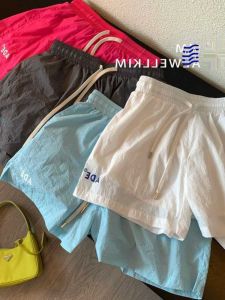 กางเกงขาสั้นผู้หญิงสีลูกกวาดแห้งเร็ว กางเกงขายาวทรงหลวม กางเกงขายาวลำลองสำหรับเล่นกีฬาในช่วงฤดูร้อน 2024 กางเกงขายาวทรงหลวมสำหรับใส่ไปทำงาน