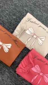 Amy Kaos Oversize Katun Motif Pita Coquette Lengan Balon LD 125 Atasan Wanita Terbaru By Deloza