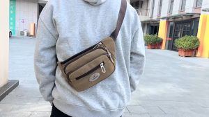 PIYU กระเป๋าสะพายผ้าใบแฟชั่นใหม่ผู้ชายกระเป๋าผ้าใบที่ทนต่อการสึกหรอกระเป๋าเป้สะพายหลังมัลติฟังก์ชั่นมือถือกระเป๋าสะพายไหล่