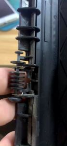 Cụm nhựa EXIT bánh xe giấy ra sấy máy in Canon 2900 3000 và Hp 1020