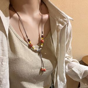 สร้อยคอผีเสื้อปักเกลือเซรามิกสไตล์โบฮีเมียนสำหรับผู้หญิง สร้อยคอแบบเชือกทอแบบย้อนยุคสไตล์ชาติพันธุ์ สร้อยคอแบบย้อนยุคสไตล์ฮันฟู