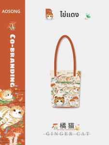 กระเป๋าผ้าใบลายแมวสีเหลือง กระเป๋าสะพายไหล่ผู้หญิงสำหรับไปทำงาน กระเป๋าสะพายข้างแบบอเนกประสงค์สุดน่ารัก กระเป๋าถือสไตล์ศิลปะ กระเป๋าผ้าใบร่วมสมัย