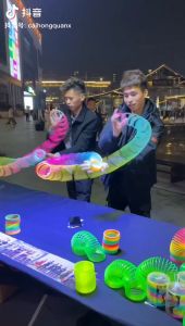 Childrens Magic Plastic Spring Ring Rainbow Circle Glowing Star Projection Toy