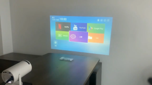 【100% ของแท้ 】Xiaomi ใหม่ HY300 โปรเจคเตอร์ขนาดเล็กพกพา รองรับ WiFi/5G Android 11.0 รองรับการเชื่อมต่อ Bluetooth สำหรับการมิเรอร์โทรศัพท์มือถือ Android/iOS เครื่องฉายภาพยนตร์กลางแจ้งแบบพกพา 1080P อินเทอร์เฟซ HDMI/USB ในตัว Netflix Youtube Google Projector