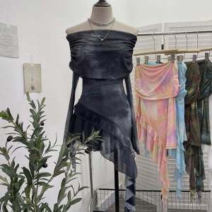 เสื้อเชิ้ตผ้าตาข่ายแขนยาวแบบลำลองพิมพ์ลายผูกโบว์ไหล่ไม่สมมาตร เสื้อเชิ้ตผู้หญิงแขนยาวคอโปโลทรงหลวม