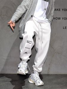 กางเกงวอร์มสเวตเตอร์กีฬาลำลองชายสไตล์อเมริกันปักลายตัวอักษรสีเทาปักลายตัวอักษรสเวตเตอร์กีฬาลำลองผ้ากำมะหยี่
