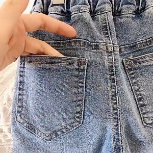 Quần jeans lưng cao ống ôm cho bé gái