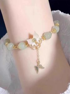 กระเป๋าถือรูปผีเสื้อสําหรับผู้หญิงที่มีพู่สไตล์ศาลย้อนยุคโลหะผสมเงินชุบทองเครื่องประดับแฟชั่น