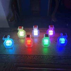 High-quality pixel-style potion-bottle night light: tap to cycle 7 colors perfect desk décor and a must-have for gamers.