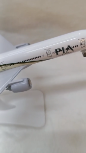 PREMIUM Diecast Pakistan International Airlines Airbus A320 model airplane on display stand with branded box.