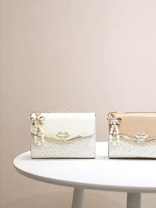 Elegant two tone shoulder bag with gold chain strap pearl bow charm perfect for everyday and special occasions handbag para sa babae fashionable accessory modelo babae