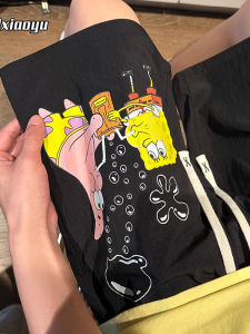 กางเกงขาสั้นทรงหลวมสไตล์อเมริกันย้อนยุคพิมพ์ลายการ์ตูนสำหรับผู้ชาย กางเกงขายาวห้าแฉกแบบลำลองในช่วงฤดูร้อน สไตล์ไฮสตรีท