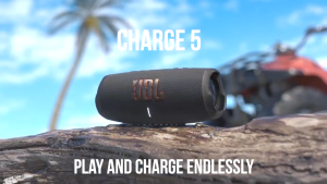 JBL Charge 5 portable speaker with fabric exterior and LED indicator.