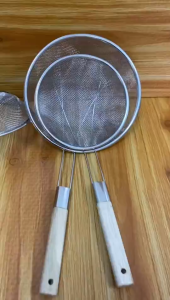 Stainless steel mesh Colander  strainer with wooden handle for kitchen use.