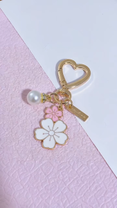 New cute chrysanthemum buttons can be used on small wallets keychains available in multiple colors Chrysanthemum and cherry blossom styles can hang keys or small wallets