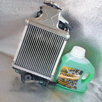 MOTORCYCLE JAPAN RADIATOR ASSY FOR HONDA CLICK 125 - Aluminum radiator with X-shaped top black fittings green coolant bottle with POWERX label.