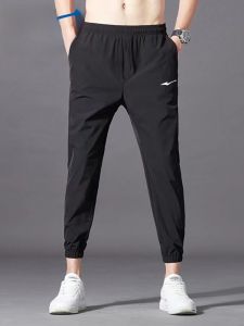 กางเกงบาสเก็ตบอลชาย Erke ฤดูใบไม้ผลิและฤดูร้อน กางเกงขายาวลำลอง น้ำหนักเบา แห้งเร็ว ผ้าไหมน้ำแข็ง ยืดหยุ่น ขากระบอก