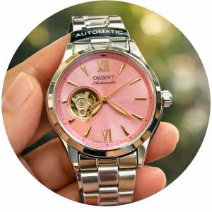 Đồng Hồ Nữ Orient RN-AG0731J Automatic Size 35.9 Pink Pastel Open Heart New 2026