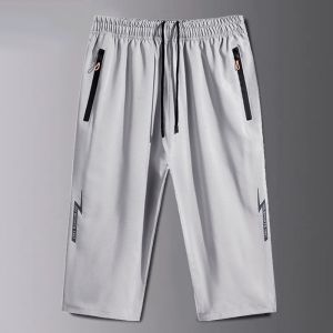 กางเกงขาสั้นผ้าไอซ์ซิลค์เก็บปลายทางล้างสต๊อกกางเกงใหญ่7ส่วนสำหรับออกกำลังกายผู้ชายกางเกงชายหาดลำลองแห้งเร็วแมตช์ชุดง่ายทรงหลวมสำหรับฤดูร้อน