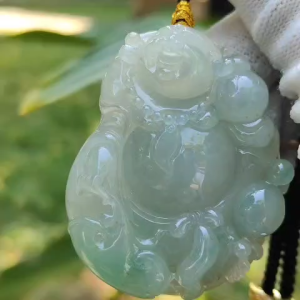 Natural Type A Jadeite Jewellery Pendant carved as Milo Buddha with Ruyi with Gemstone report from NGI weighs at 218.34 grams 53.35 * 42.19 * 12.02 mm Translucent with faint to light green with good translucency premium quality pendant (pendant156)