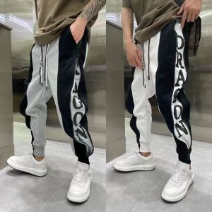 กางเกงขายาวทรงหลวมสไตล์ฮาราจูกุสำหรับผู้ชาย ทรงหลวมสบาย ๆ ฤดูใบไม้ร่วง/ฤดูหนาว สีบล็อก กางเกงขายาวทรงฮาราจูกุสุดเทรนด์สำหรับผู้ชาย