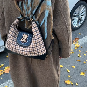 SEA YADOU  กระเป๋าโท้ทผ้าใบลำลองสำหรับผู้หญิงกระเป๋าเป้สะพายหลังแบบใหม่ความจุขนาดใหญ่มัลติฟังก์ชั่นขั้นสูงความรู้สึกเดินทางกระเป๋าเป้สะพายหลัง