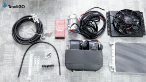 12V Brushed Black automotive air conditioning kit with fan compressor hoses wiring and mounting hardware.