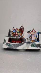 ONELINE #FC710  A  festive Light-up Christmas Village Scene with music featuring an animated train and a spinning carousel
