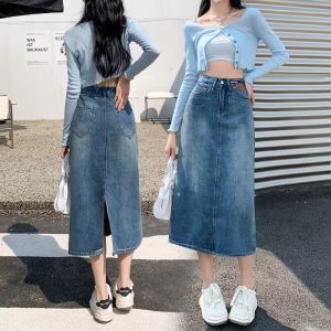 กระโปรงยีนส์เอวสูงทรงเอเข้ารูปสำหรับผู้หญิง ฤดูร้อน 2024 กระโปรงทรงเอเข้ารูปยาวปานกลาง กระโปรงสั้น ผ้าฝ้าย ทรงหลวม สไตล์กลางแจ้ง