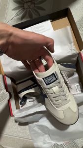 รองเท้ากีฬาย้อนยุคสไตล์คลาสสิก MEXICO 66ปี2025รองเท้าลำลองสำหรับทั้งหญิงและชายกันลื่นหนังรองเท้าระบายอากาศใส่สบายสีเบจ/สีน้ำเงินเข้ม